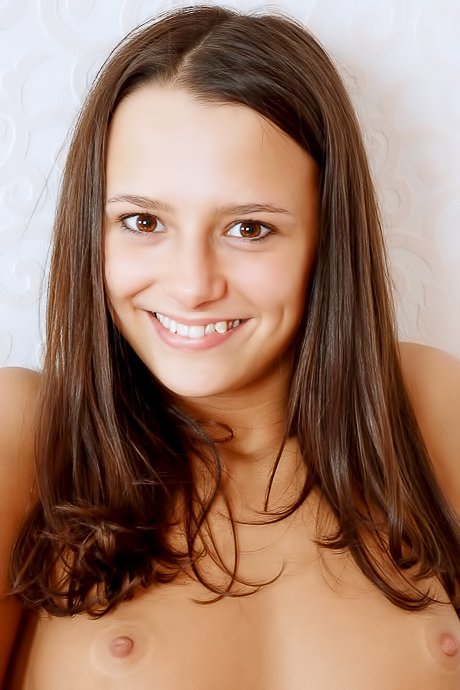 Naturally appealing brunette girl bends over to show her bunghole