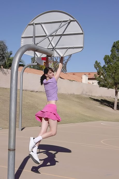 Pink skirt babe has on a playground before stripping totally naked